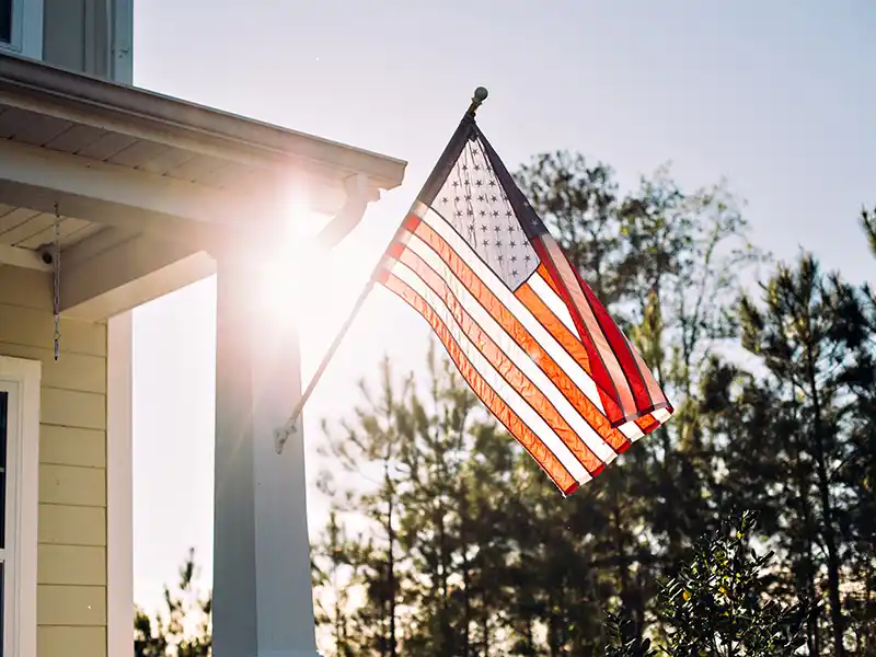American flag displayed in front of a home