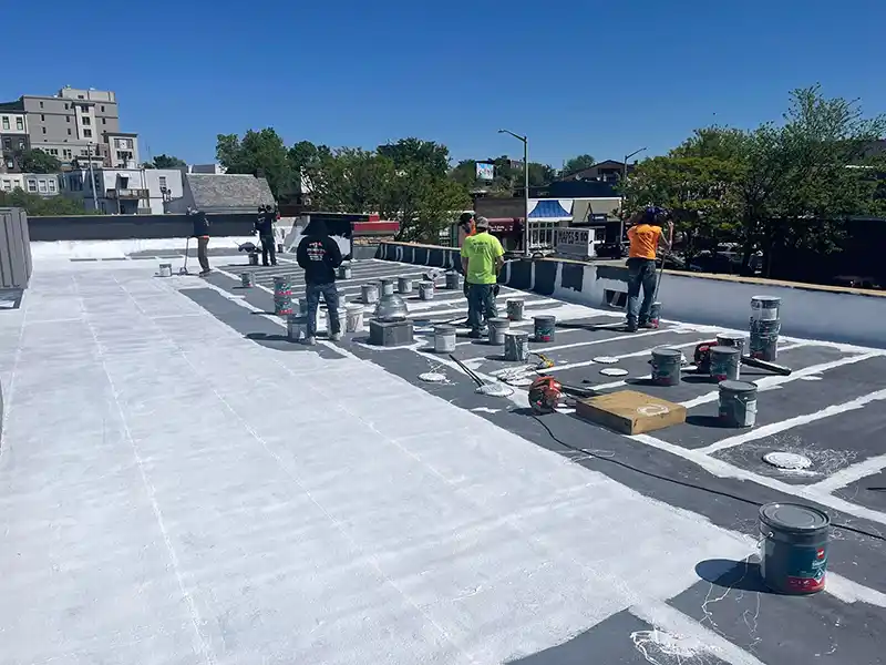 Jim Miller Inc. crew in the middle of a new flat roof install on a commercial building